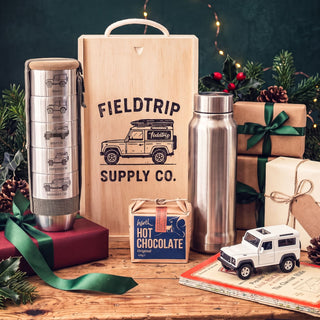 Land Rover Cups & Flask Gift Set at Christmas: five cups engraved with Land Rovers from the Series I to the Defender 110, the flask, Harth hot chocolate and the wooden gift box
